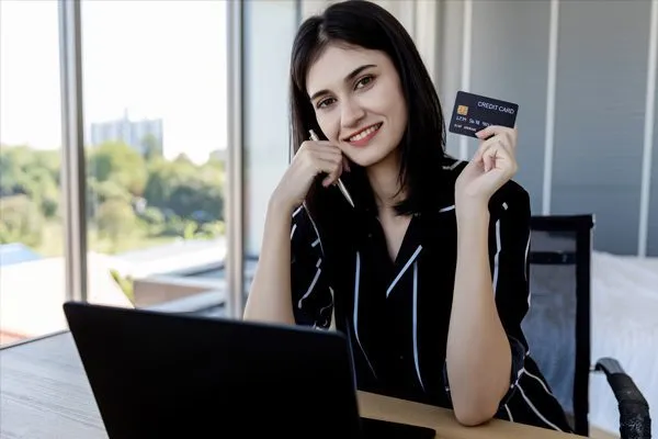 woman consumer holding credit card and smart phone 2024 01 16 21 43 06 utc